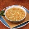 picture of a bowl of savory chicken noodle soup by SkinnyBox