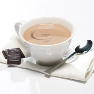 Picture of SkinnyBox - Hot Chocolate - in a mug with a spoon beside it and chocolate pieces on the other side